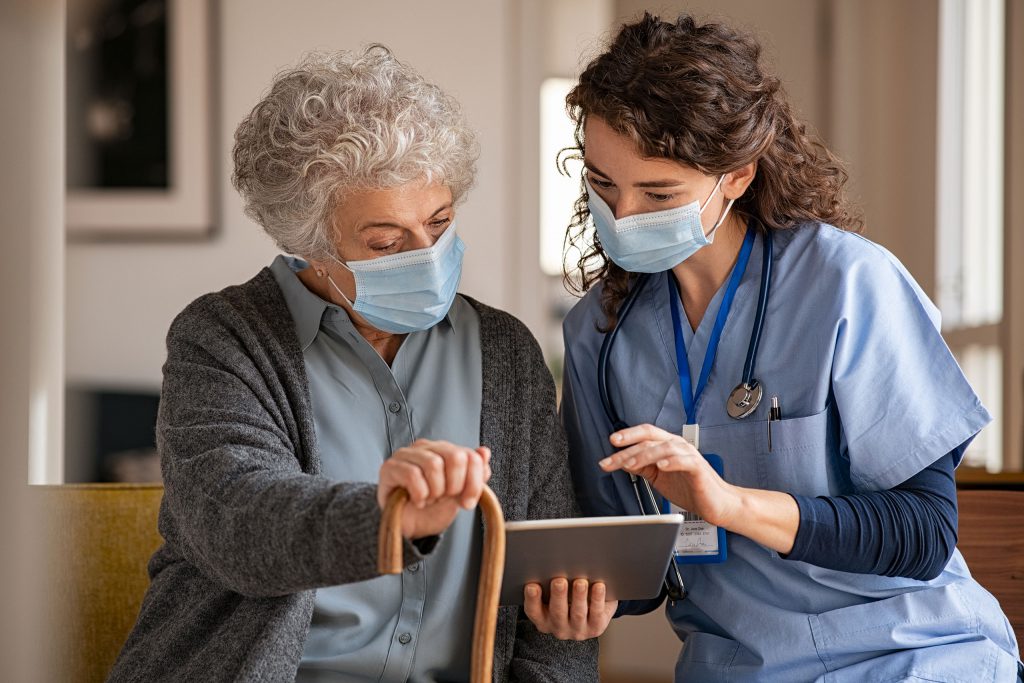 Nurse with patient on tablet