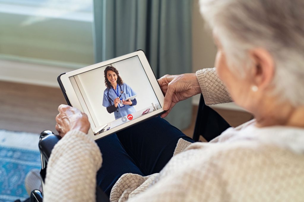 Woman meeting with health care provider on tablet